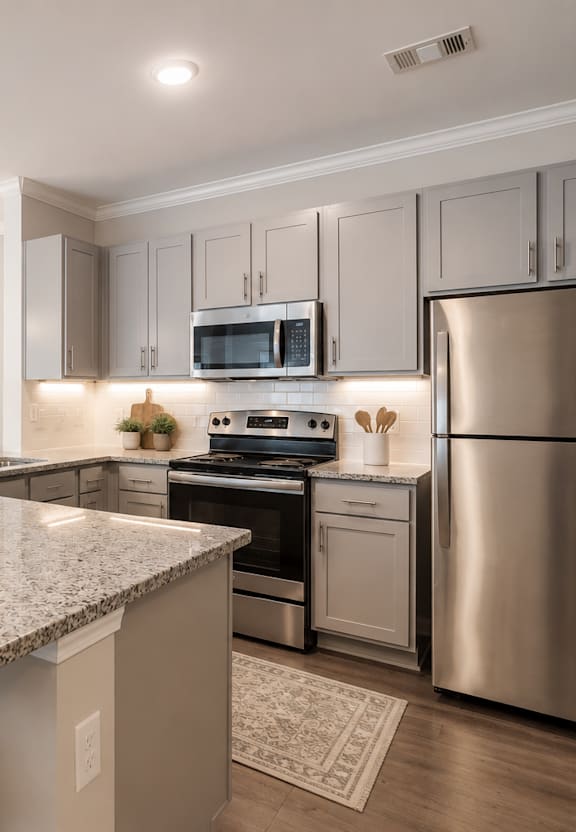 a kitchen and dining area with a large counter top  at Lullwater at Big Ridge, Hixson, Tennessee