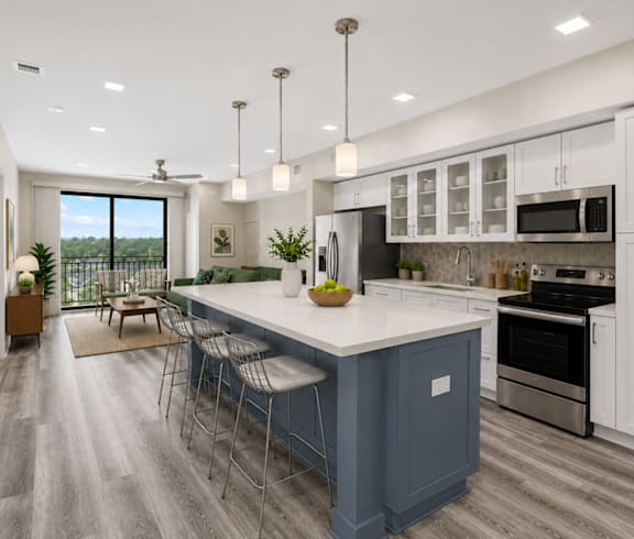 A modern kitchen with a blue island and white cabinets.