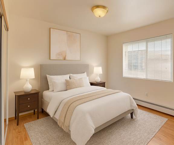 A kitchen with a stove and a sink and a refrigerator at Amber Ridge Apartments. 