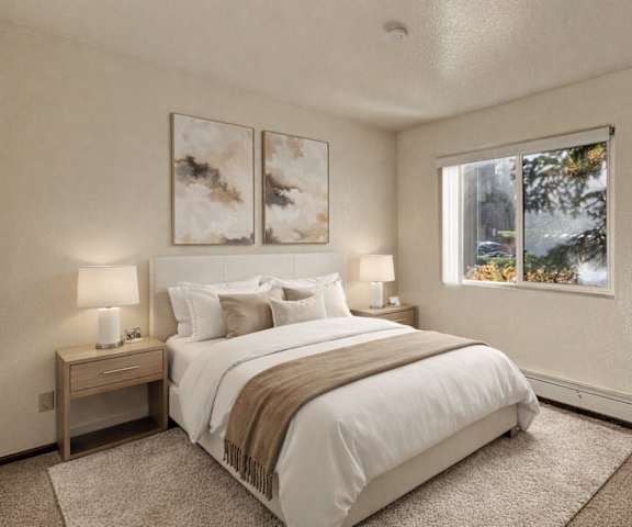 An empty carpeted bedroom with a window at Ladera Villa Apartments. 