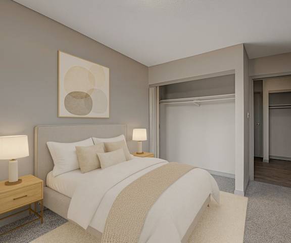An empty bedroom with a window and carpet at Cedar Gardens Apartments. 