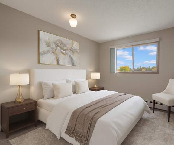 A kitchen with wooden counters, white appliances and counters at Gateway Square. 