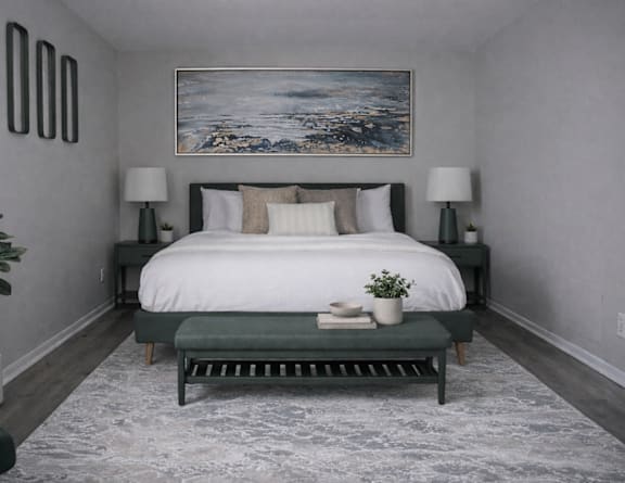 A bedroom with a large bed and a painting on the wall.