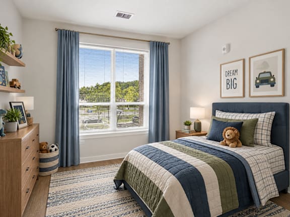 A bedroom with a bed, a dresser, and a window with a view.