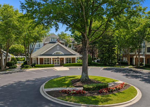 A building with a sign in front that says Welcome Center.