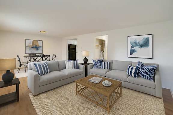 A living room with a grey couch and a coffee table.