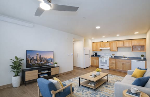 a kitchen and living room at The Aries at Bitter Lake Apartments, Washington