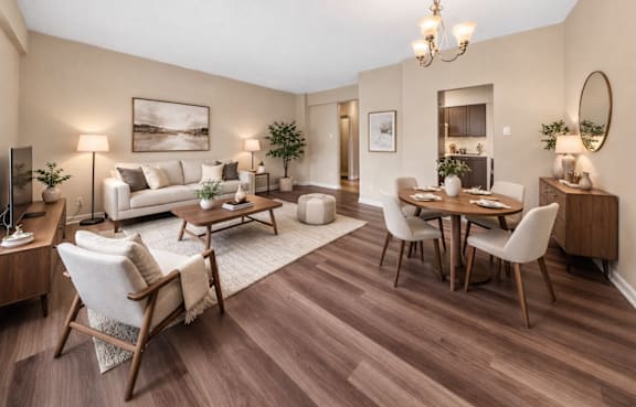 A well-lit, spacious living room with a dining area and a couch.
