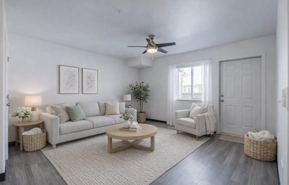 A living room with a sofa, chairs, and a coffee table.