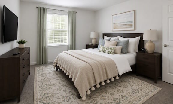 A bedroom with a large bed, a dresser, and a window with curtains.