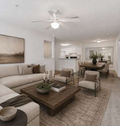 A living room with a large couch and a coffee table.