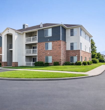 A large apartment complex with a parking lot in front. at Haven Pointe Apartments, Utah, 84401
