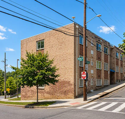 A street view of a residential area with a no entry sign.