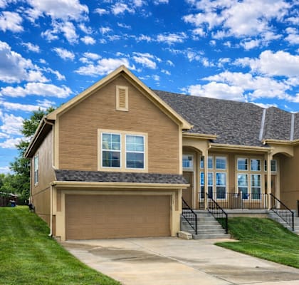 A large house with a garage and a driveway.