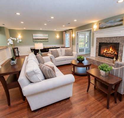 A living room with a fireplace and a couch.