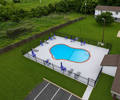 A small pool surrounded by a fence.
