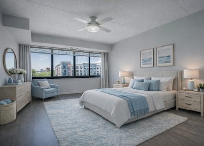 A bedroom with a large bed and a view of the city.