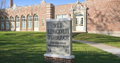 A sign in front of a building that says Lincoln Terrace.