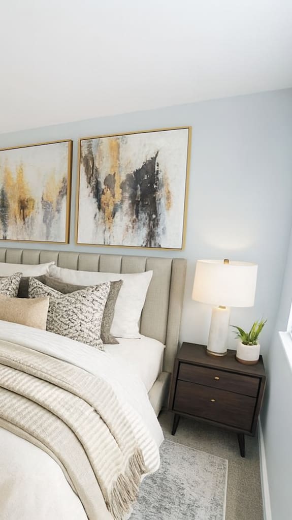 a bedroom with a large bed and a window