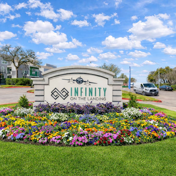 A small bridge over a waterway in a city park. at Infinity on the Landing Apartments, Euless 76040