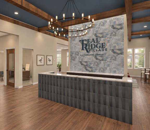 A reception area for Teal Ridge Village with a long reception desk and a chandelier hanging from the ceiling.