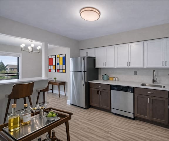 A modern kitchen with a refrigerator, stove, and sink. at Rochester Club Apartments, Rochester, 48306