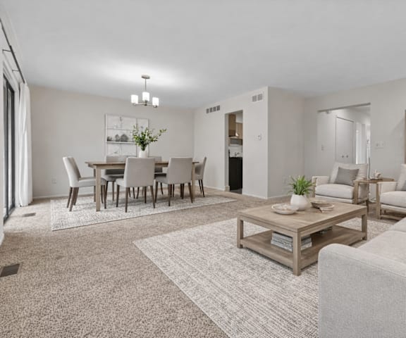 A living room with a grey couch and a coffee table.