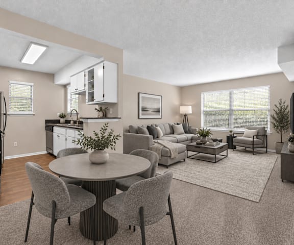 A modern kitchen with a dining table set for two.