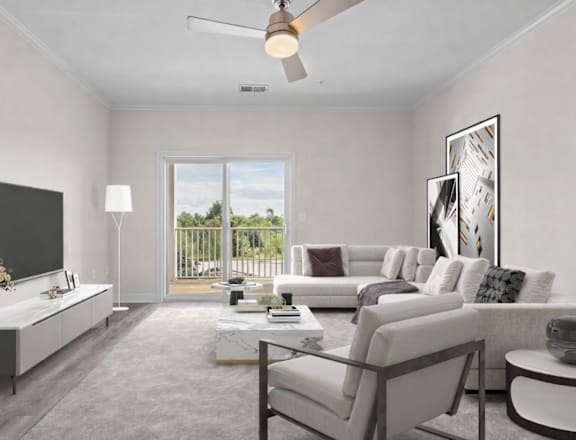 A modern living room with a flat screen TV, a white sofa, and a glass coffee table.