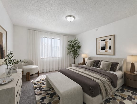 A bedroom with a large bed and a small tree in the corner.