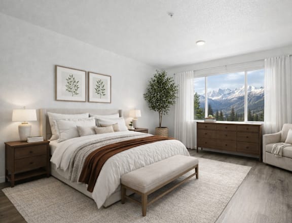 A bedroom with a large bed, a chair, and a view of the mountains through the window.