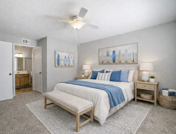 A bedroom with two beds and a ceiling fan. at Waterbridge Apartments , Orlando, FL, 32837