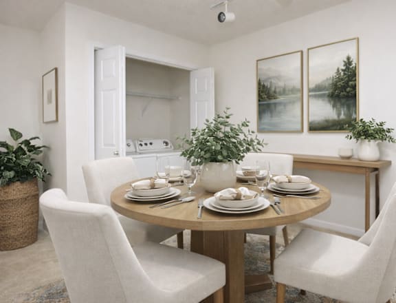 A dining room with a round table set for four.
