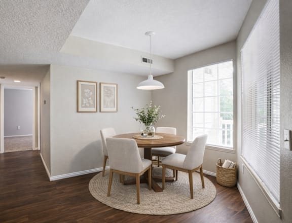 A dining room with a round table and chairs. at Haven Pointe Apartments, Utah, 84401