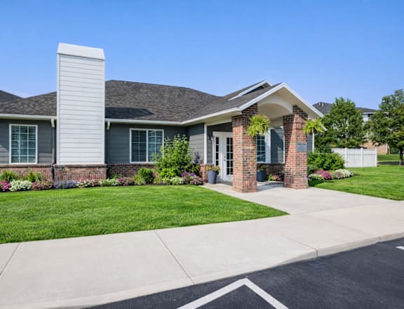 A house with a grey roof and a brick pillar in front. at Haven Pointe Apartments, Utah, 84401
