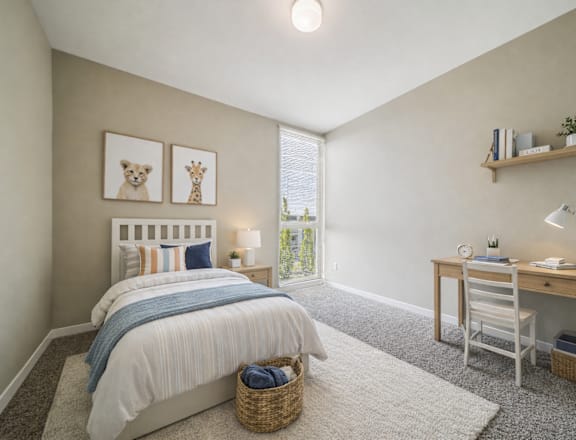 A bedroom with a bed, desk, and chair.
