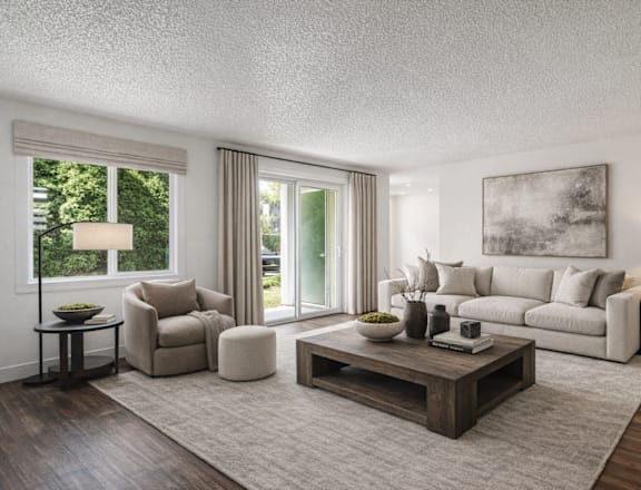 A living room with a grey sofa, a wooden coffee table, and a large painting on the wall.