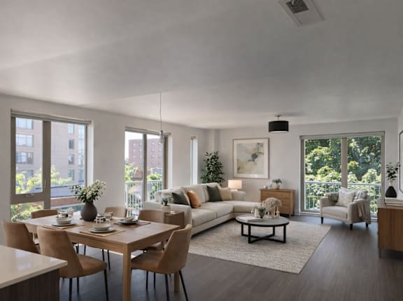 A modern living room with a dining table and chairs.