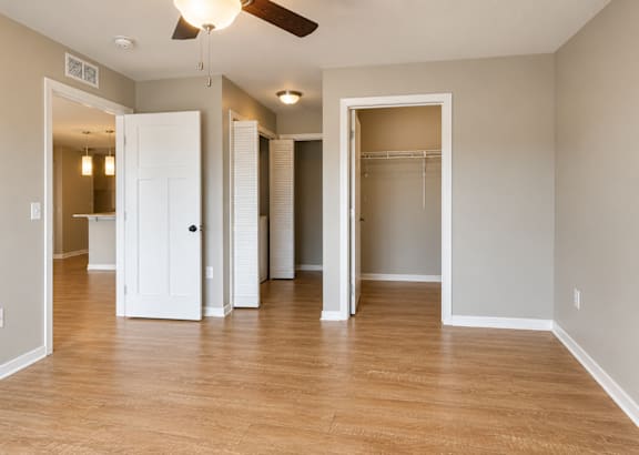 A room with a ceiling fan and wooden flooring.at Hawthorne Pointe, Bondurant, 50035