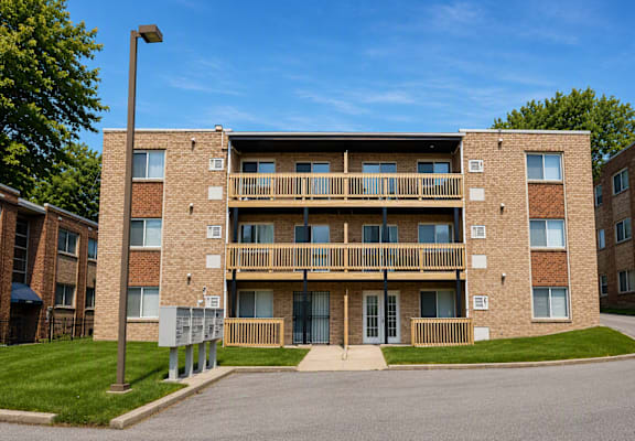 A large brick building with a balcony on the second floor.