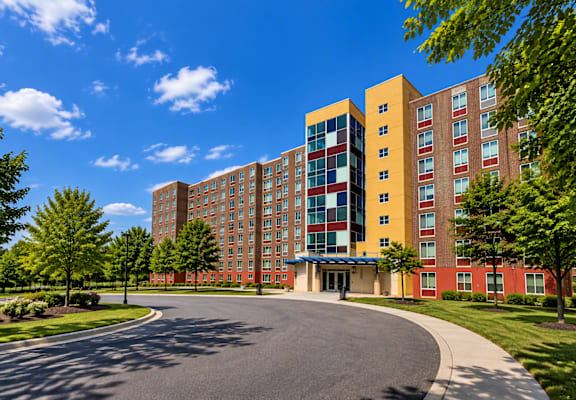 A large multi-story building with a red and yellow exterior.