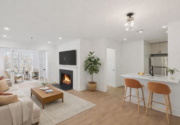 A living room with a fireplace and a couch.