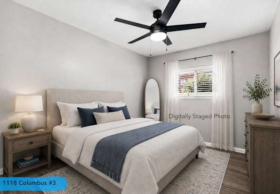 Bedroom with bed and black ceiling fan at OSM Properties Homes & Apartments, Chico, 95926