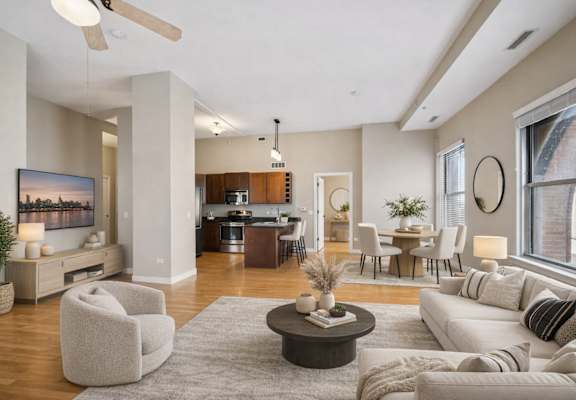 A modern living room with a large painting on the wall and a ceiling fan.