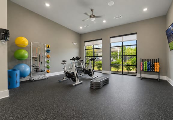 Spacious fitness center with cardio and strength-training equipment at Auberge of Tyler.