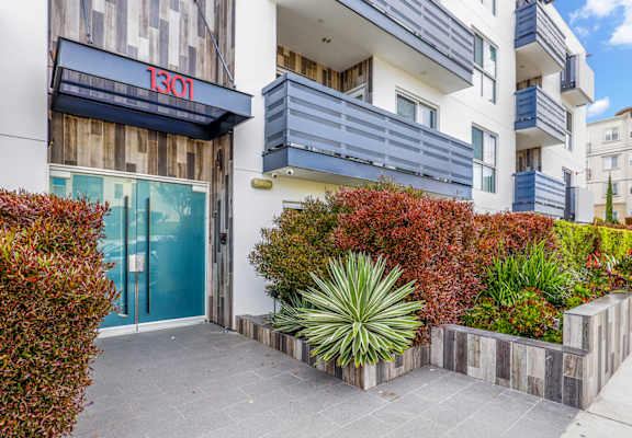 an image of the front of a building with a blue door