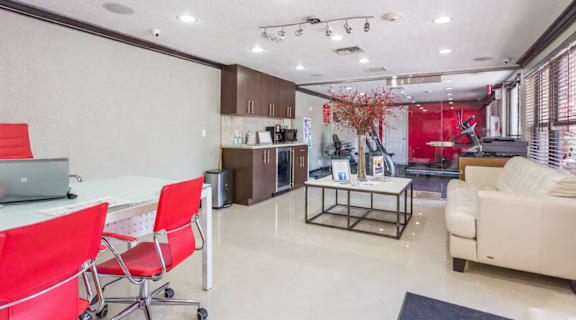 A modern living room with a dining table and chairs.