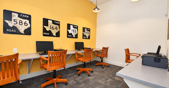 A conference room with a yellow wall and a sign that says Farm Road 586.