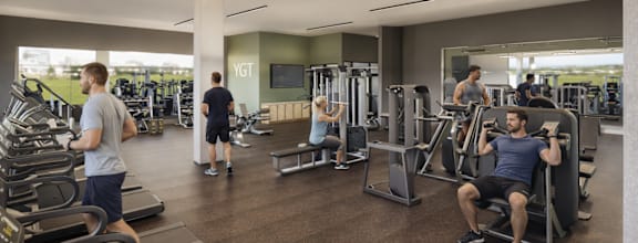 A gym with people exercising and a sign that says "YGT".
