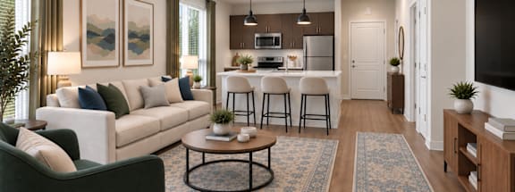 A modern living room with a white sofa, a coffee table, and a kitchen area in the background.